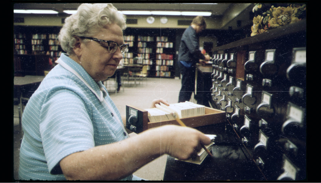 Image of a Libriarian working in a library in the mid-1900's